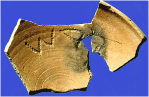 Pottery fragment with ancient hebrew text on it